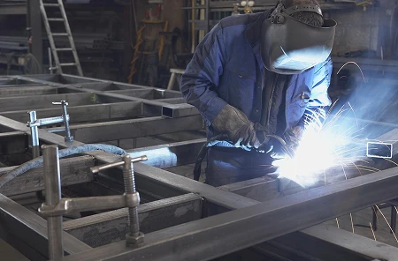 Home Welder fabricating steel frame